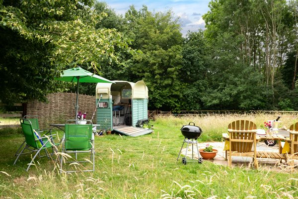 Fire pit patio, table chairs and umbrella and trailer kitchen for cooking